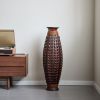 A 39-inch tall hand-woven bamboo floor vase - a decorative highlight for the living room